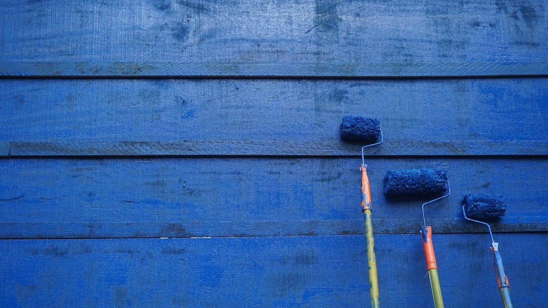 blue wall paint roller closeup
